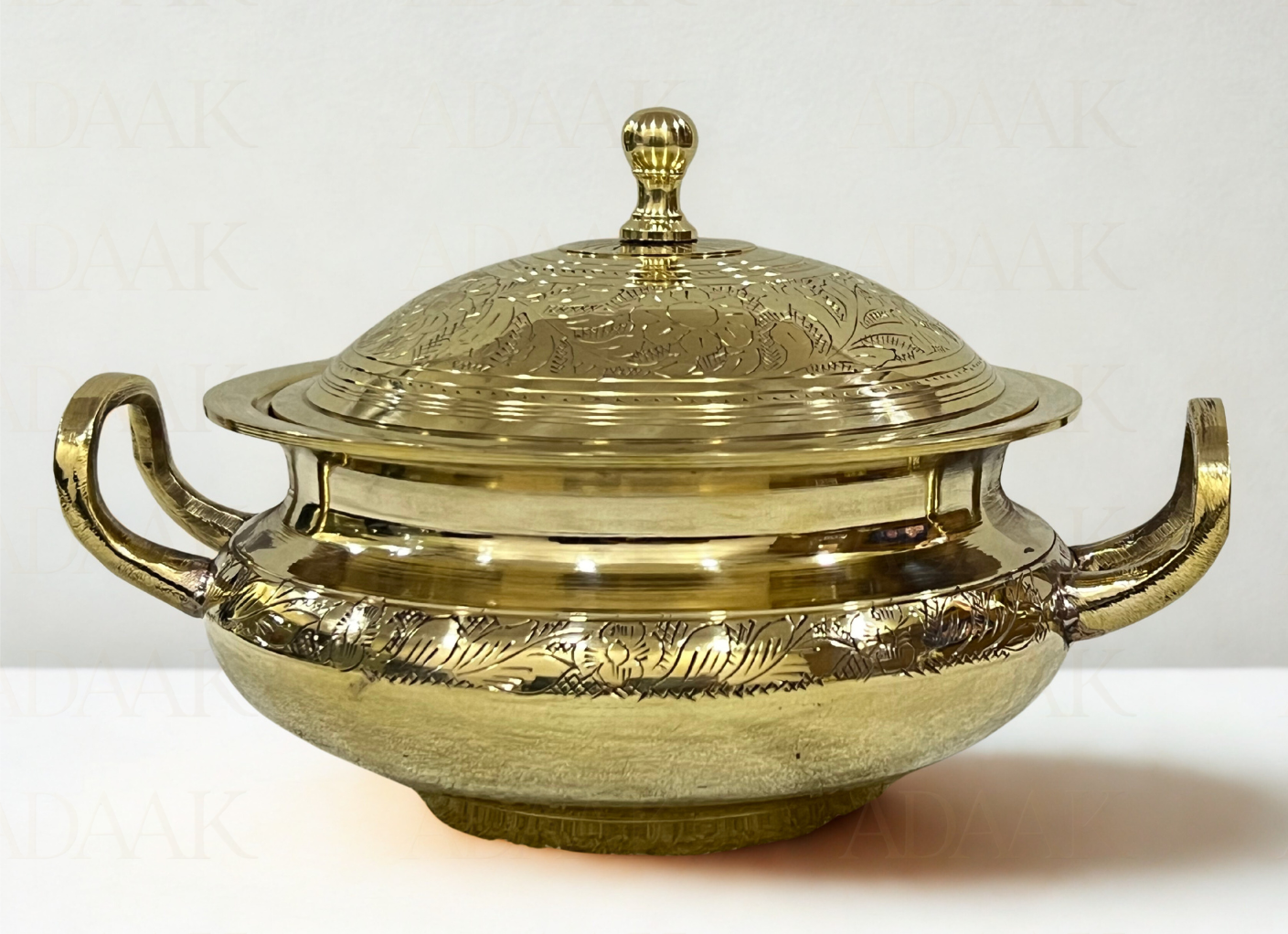 Brass dish with lid on a white background