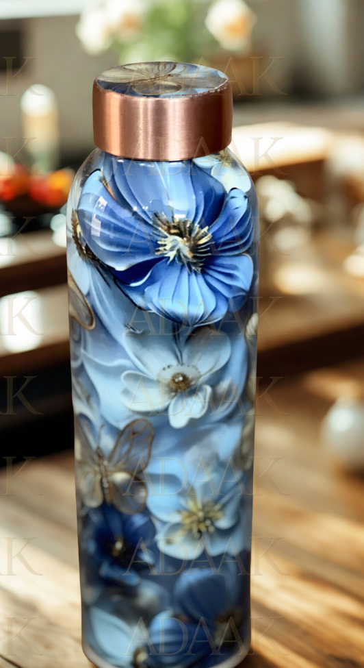 Decorative water bottle with blue floral design on a wooden surface