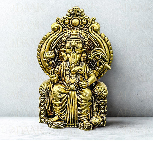 Brass Ganeshji on chair