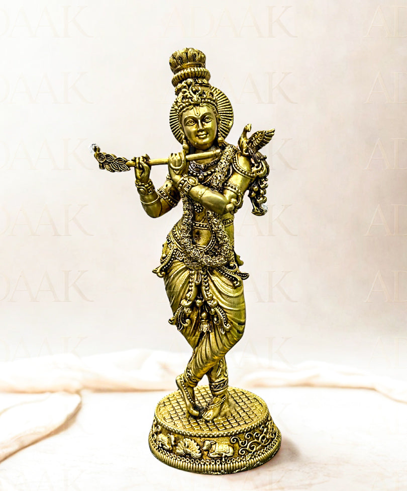 brass statue of krishnaji with flute