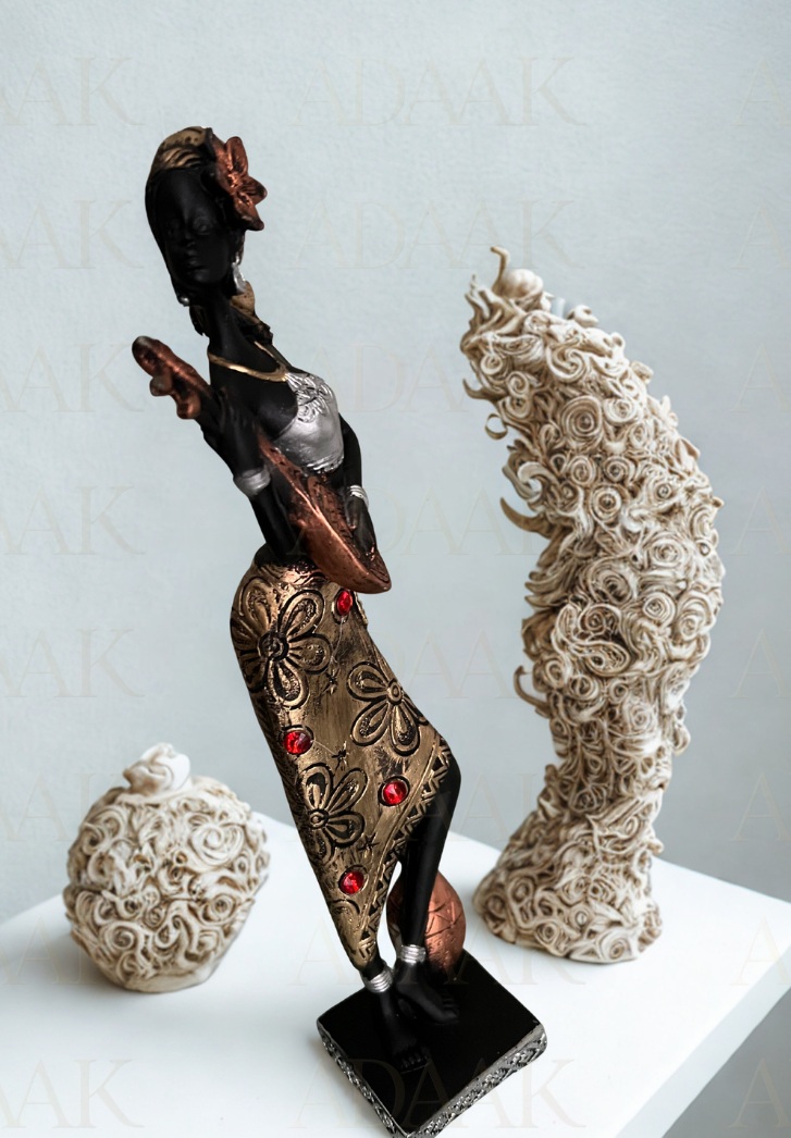 Decorative sculptures on a white surface with a light gray background