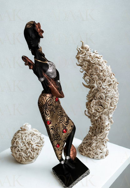 Decorative sculptures on a white surface with a light gray background